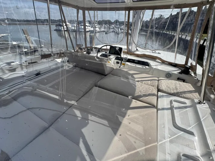 Eden Yacht Photos Pics 2022 Lagoon 46 yacht interior with spacious seating and marina view.