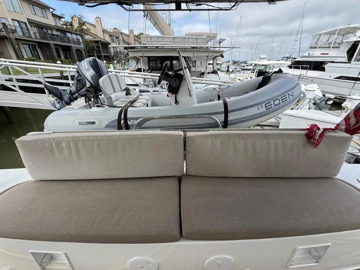 Eden Yacht Photos Pics Lagoon 46 yacht with inflatable dinghy on deck, docked at marina, 2022 model.