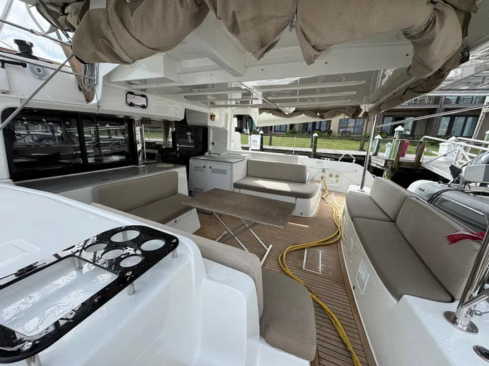 Eden Yacht Photos Pics 2022 Lagoon 46 yacht interior with spacious seating and modern design.