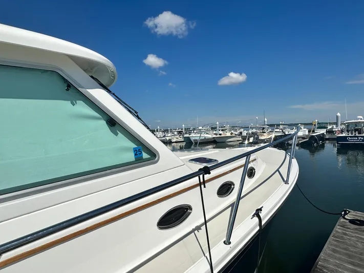 Reveille Yacht Photos Pics 2013 Back Cove 34 boat docked at marina under clear blue sky.