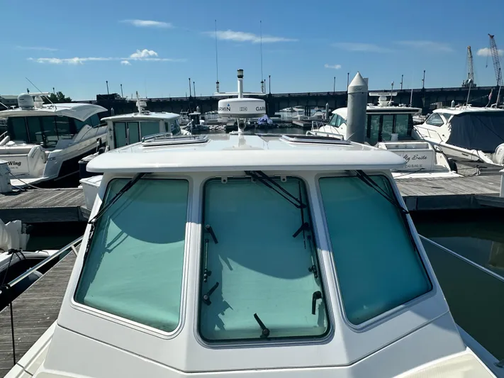 Reveille Yacht Photos Pics 2013 Back Cove 34 boat docked at marina under clear blue sky.