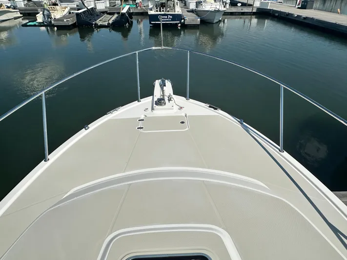 Reveille Yacht Photos Pics Bow view of 2013 Back Cove 34 boat docked in a marina.
