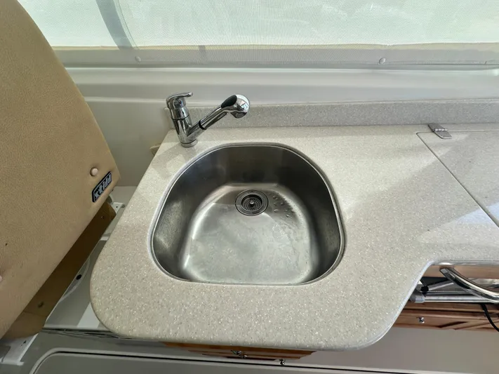 Reveille Yacht Photos Pics 2013 Back Cove 34 boat kitchen sink with modern faucet and countertop.