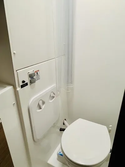 Unicorn Yacht Photos Pics 2019 Lagoon 40 yacht bathroom with modern white fixtures and compact design.