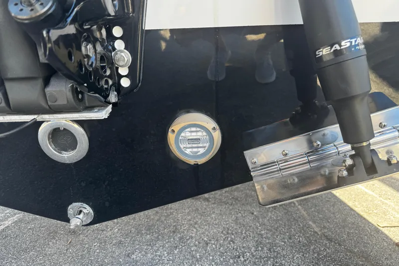  Yacht Photos Pics Close-up of 2026 Sea Pro 245FLX Sandbar boat's rear components and SeaStar hydraulic system.