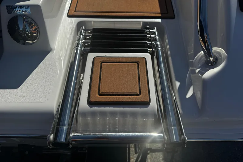  Yacht Photos Pics 2026 Sea Pro 245FLX Sandbar boat ladder with teak steps and fresh water access.