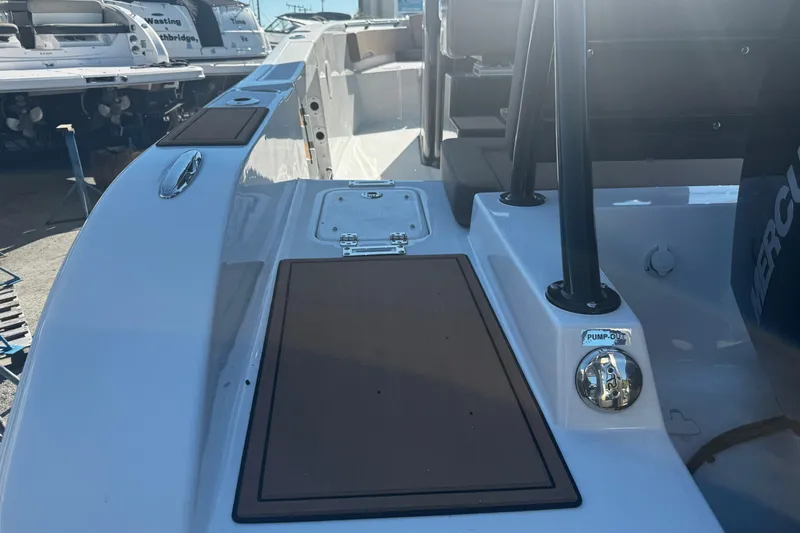  Yacht Photos Pics 2026 Sea Pro 245FLX Sandbar boat deck with storage compartments and pump-out feature.
