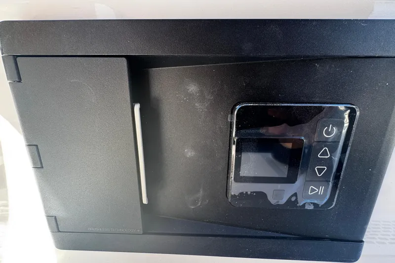  Yacht Photos Pics Control panel on 2026 Sea Pro 245FLX Sandbar boat, featuring digital display and buttons.