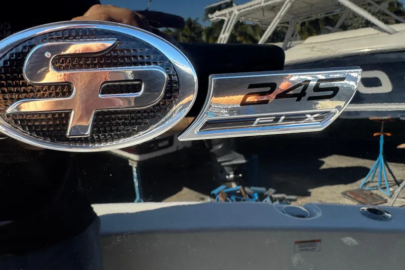  Yacht Photos Pics 2026 Sea Pro 245FLX Sandbar boat emblem with chrome detailing.