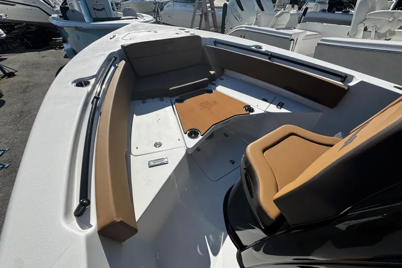  Yacht Photos Pics 2026 Sea Pro 245FLX Sandbar boat interior with brown seating and white deck.