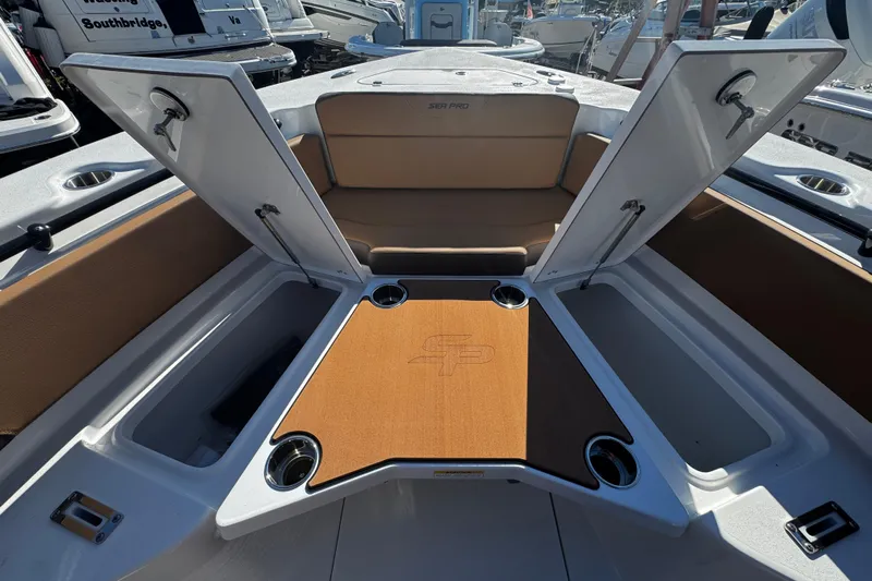  Yacht Photos Pics 2026 Sea Pro 245FLX Sandbar boat interior with open storage compartments and cup holders.