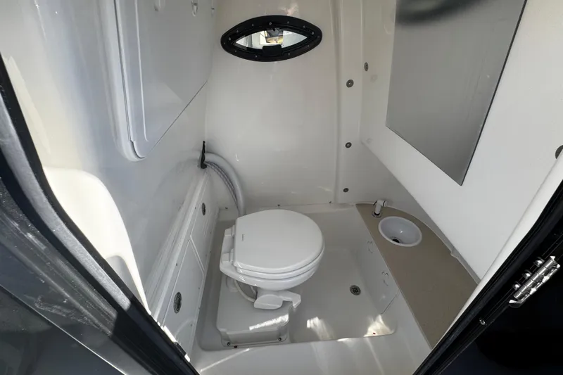  Yacht Photos Pics Interior of 2026 Sea Pro 245FLX Sandbar boat bathroom with toilet and sink.