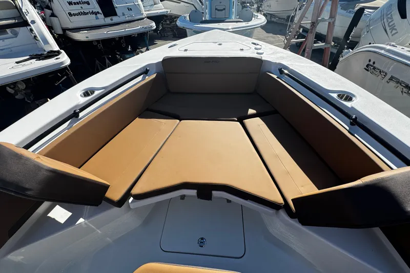  Yacht Photos Pics 2026 Sea Pro 245FLX Sandbar boat interior with tan seating and cup holders.