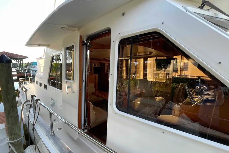 Free Ride Yacht Photos Pics 2002 President Trawler yacht exterior with open cabin door and visible interior.