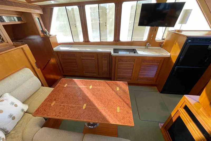 Free Ride Yacht Photos Pics Luxurious 2002 President Trawler interior with elegant wood finishes and modern amenities.