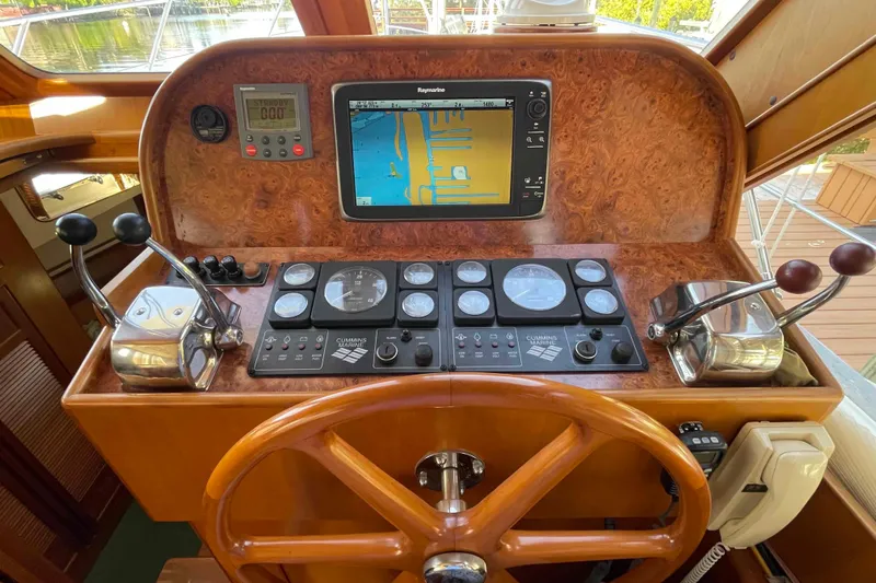 Free Ride Yacht Photos Pics Control panel of a 2002 President Trawler with navigation and engine controls.