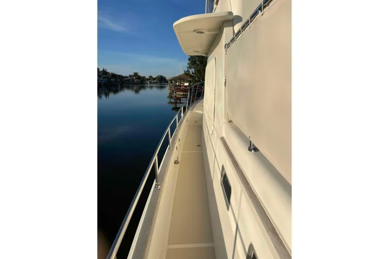 Free Ride Yacht Photos Pics 2002 President Trawler yacht deck with serene waterfront view.