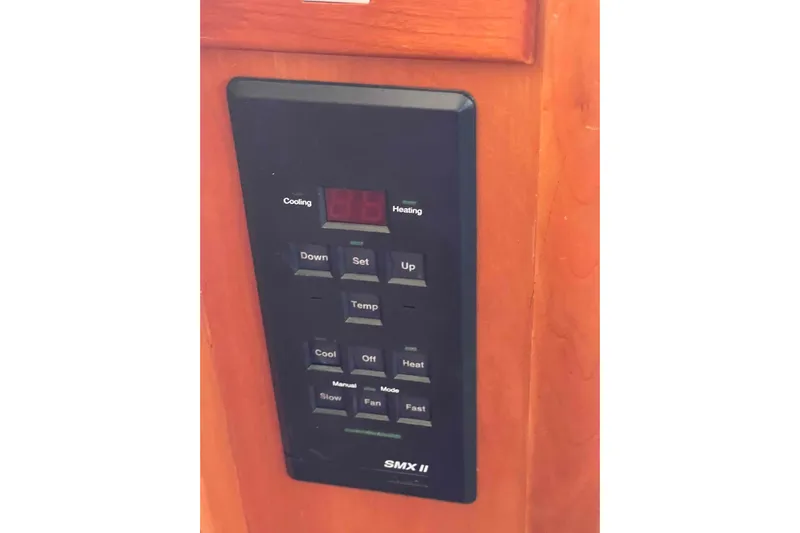 Free Ride Yacht Photos Pics Control panel on 2002 President Trawler, featuring temperature and fan settings.