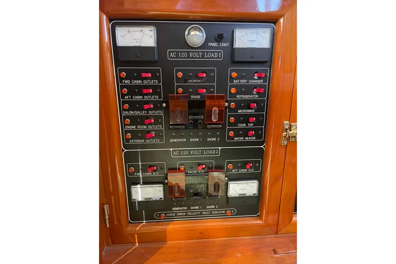Free Ride Yacht Photos Pics Electrical control panel on a 2002 President Trawler boat, featuring various switches and meters.