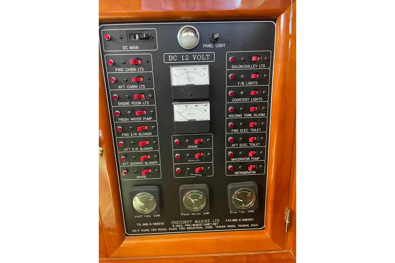 Free Ride Yacht Photos Pics Control panel of a 2002 President Trawler with various switches and gauges.