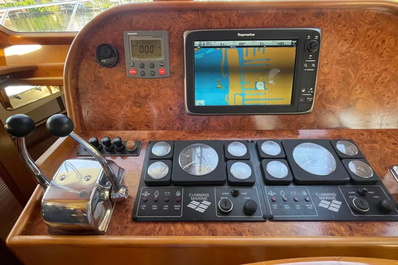 Free Ride Yacht Photos Pics Control panel of a 2002 President Trawler with navigation and engine gauges.