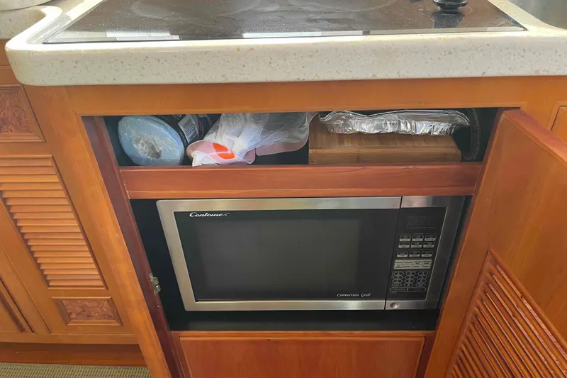 Free Ride Yacht Photos Pics Microwave and storage in 2002 President Trawler kitchen cabinet.