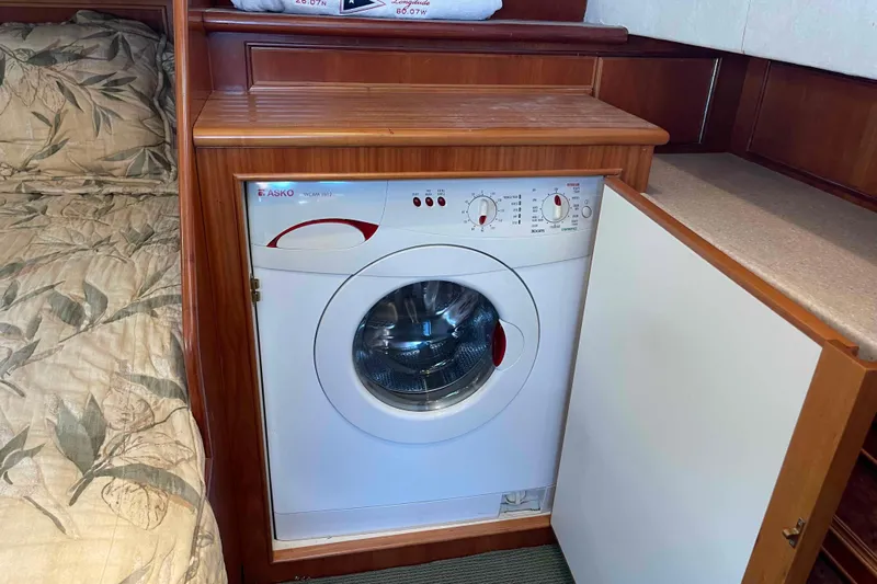 Free Ride Yacht Photos Pics Compact washing machine in 2002 President Trawler's wooden interior cabin.