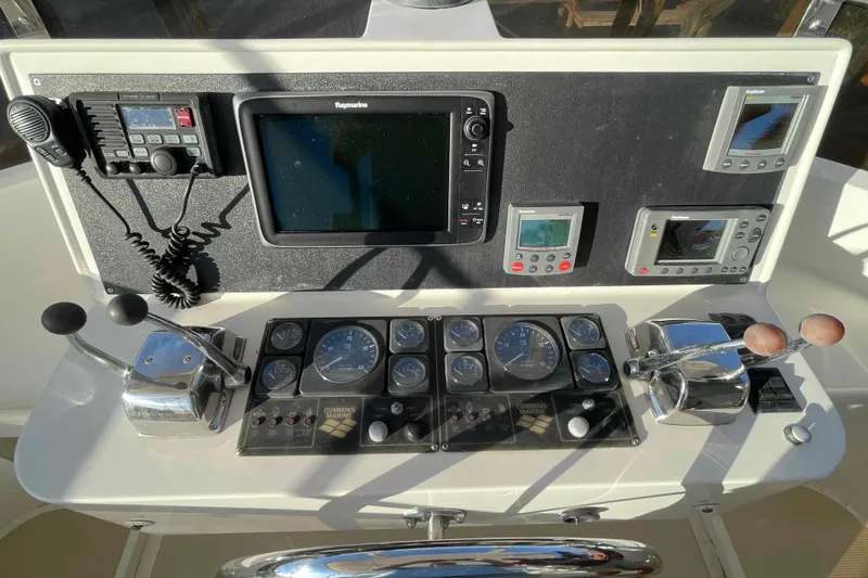 Free Ride Yacht Photos Pics Control panel of a 2002 President Trawler with navigation and communication equipment.