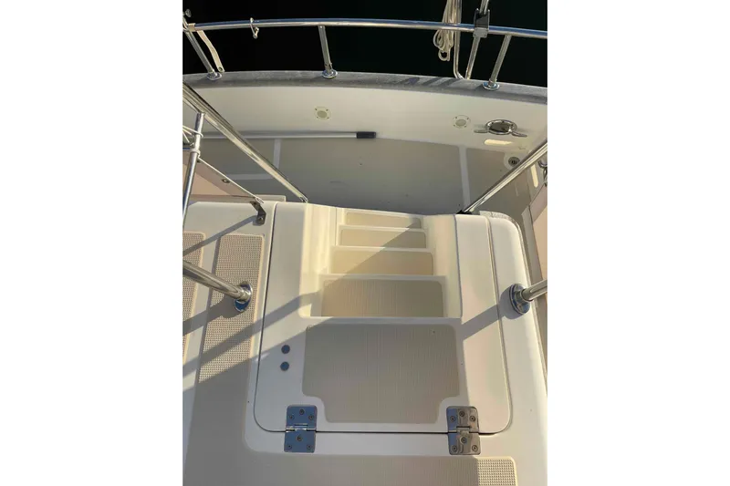 Free Ride Yacht Photos Pics Staircase on 2002 President Trawler boat with metal railings and non-slip surface.