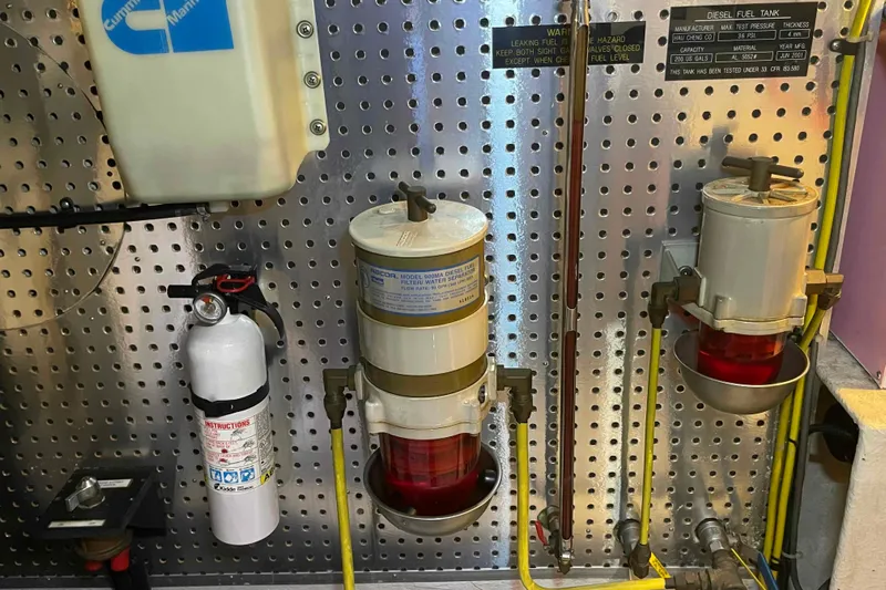 Free Ride Yacht Photos Pics Engine room of 2002 President Trawler with fuel filters and fire extinguisher.