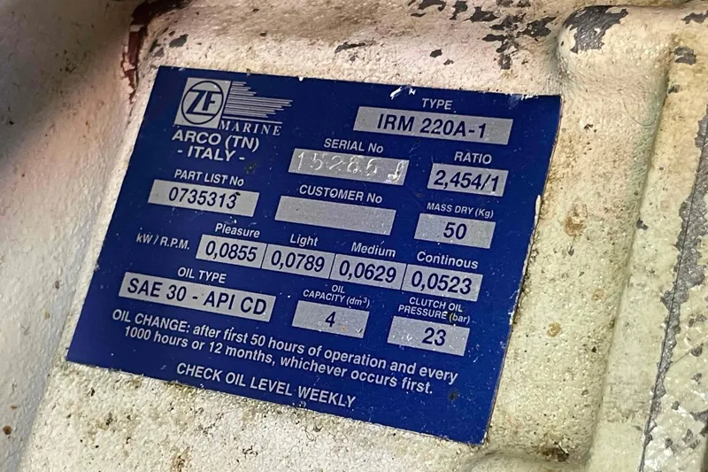 Free Ride Yacht Photos Pics Label on a 2002 President Trawler engine, detailing specifications and oil change instructions.