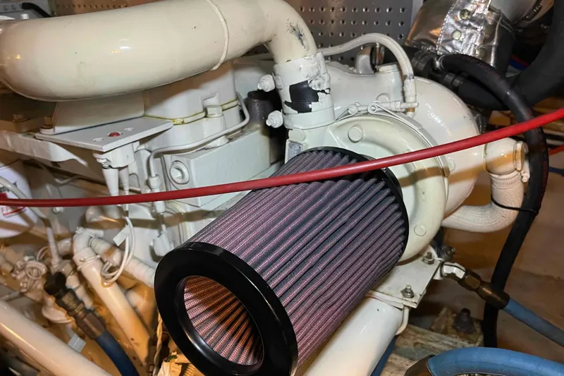 Free Ride Yacht Photos Pics Engine compartment of a 2002 President Trawler with visible air filter and piping.