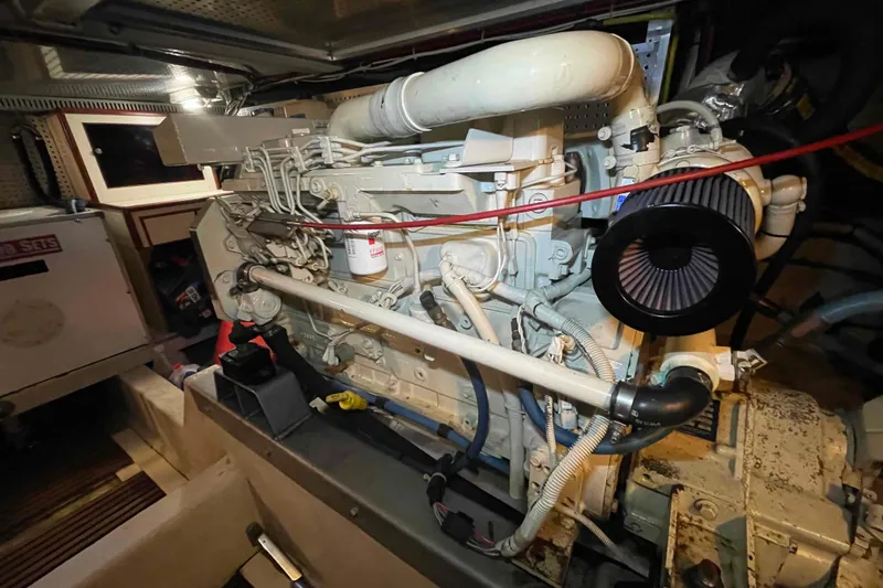 Free Ride Yacht Photos Pics Engine room of a 2002 President Trawler, showcasing detailed machinery and components.