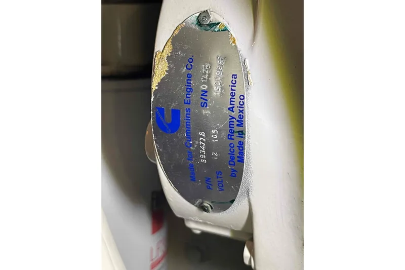 Free Ride Yacht Photos Pics Engine plate on a 2002 President Trawler, featuring Cummins branding and specifications.