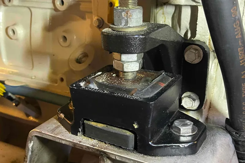 Free Ride Yacht Photos Pics Engine mount detail on a 2002 President Trawler, showcasing bolts and metal components.