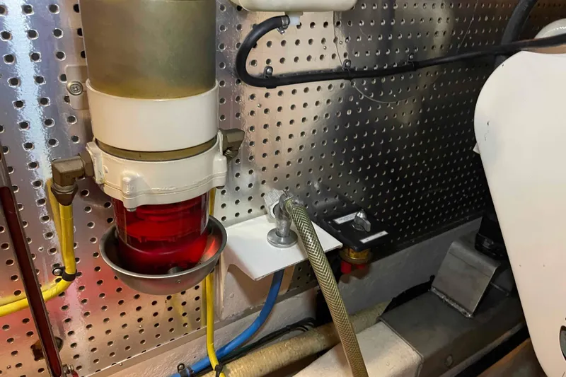 Free Ride Yacht Photos Pics Engine room of a 2002 President Trawler with fuel filter and hoses.