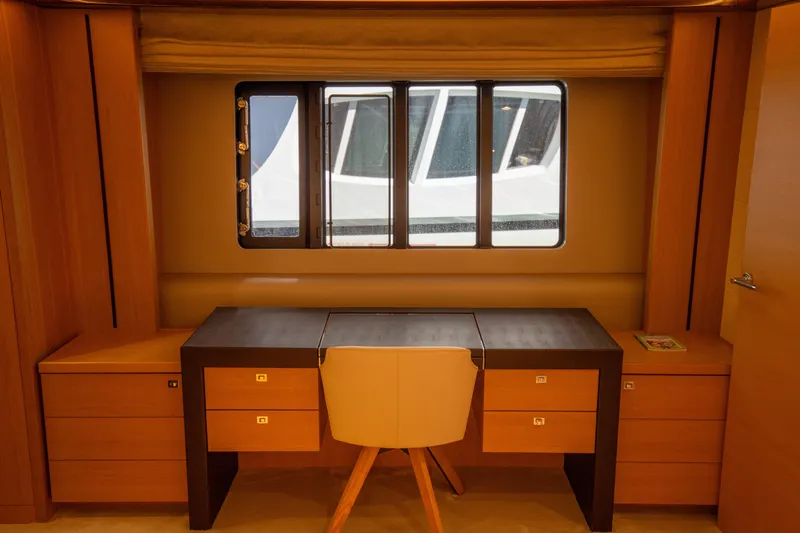  Yacht Photos Pics Luxurious interior of 2012 Princess V72 yacht with elegant desk and window view.