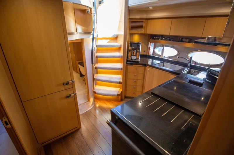  Yacht Photos Pics Luxurious 2012 Princess V72 yacht interior with modern kitchen and elegant wooden finishes.