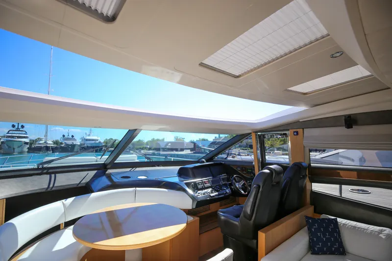  Yacht Photos Pics Luxurious interior of 2012 Princess V72 yacht with panoramic windows and modern helm.