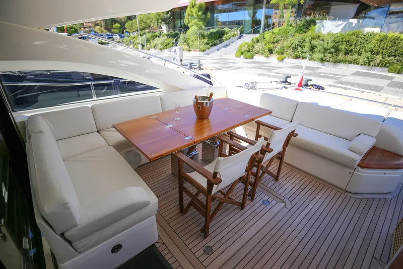  Yacht Photos Pics Luxurious 2012 Princess V72 yacht deck with elegant seating and dining area.
