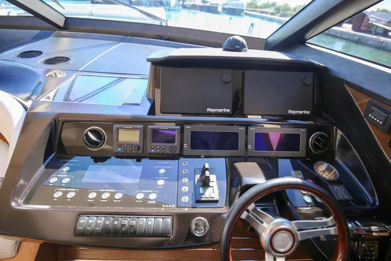  Yacht Photos Pics Control panel of a 2012 Princess V72 yacht with advanced navigation systems.