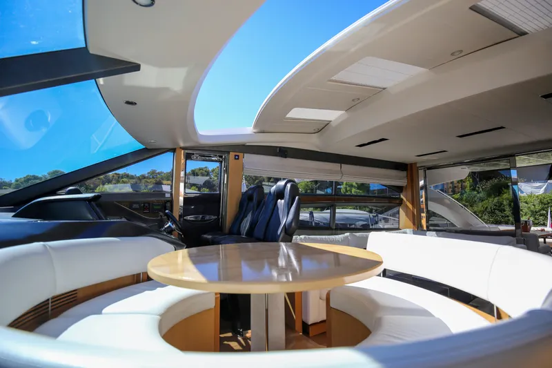  Yacht Photos Pics Luxurious interior of 2012 Princess V72 yacht with sleek seating and panoramic windows.