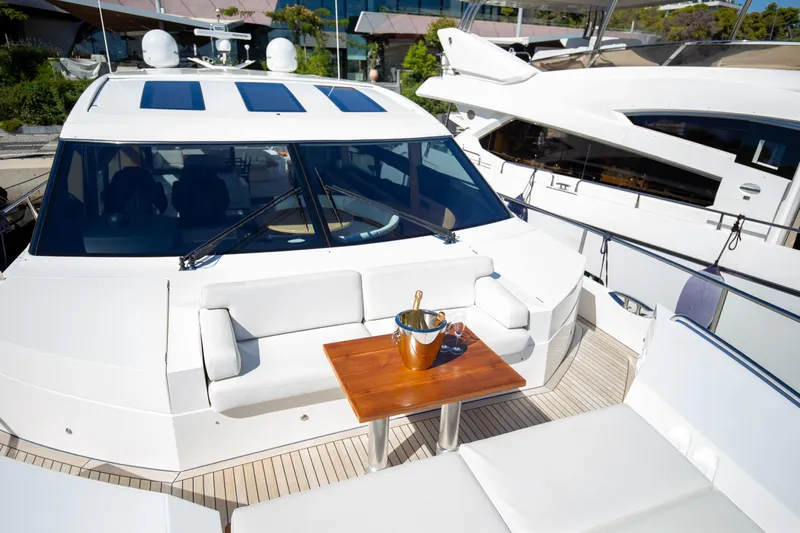  Yacht Photos Pics Luxurious 2012 Princess V72 yacht deck with seating and champagne bucket.