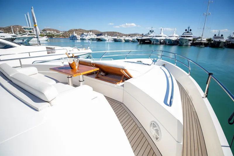  Yacht Photos Pics Luxurious 2012 Princess V72 yacht deck with seating, table, and ocean view.