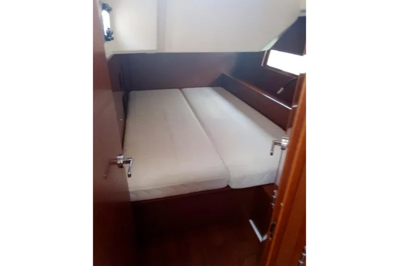  Yacht Photos Pics 2019 Beneteau Oceanis 46.1 cabin interior with bed and wooden finish.