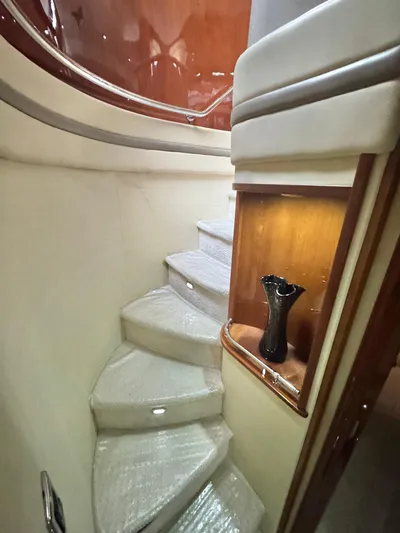  Yacht Photos Pics Staircase in 2006 Marquis 65 yacht with elegant wood and modern design.