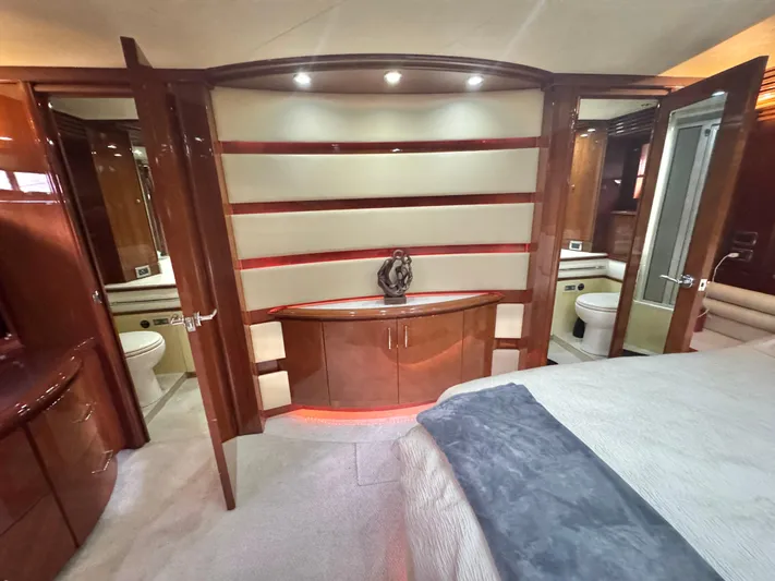  Yacht Photos Pics Luxurious interior of a 2006 Marquis 65 yacht featuring elegant wood cabinetry and modern design.