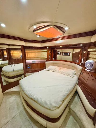  Yacht Photos Pics Luxurious interior of a 2006 Marquis 65 yacht with elegant wood finishes.