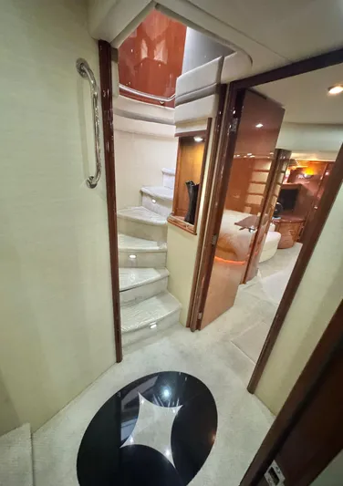  Yacht Photos Pics Interior of 2006 Marquis 65 yacht with elegant staircase and modern design.