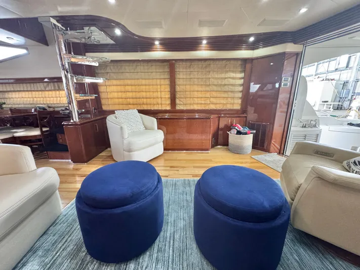  Yacht Photos Pics Luxurious interior of a 2006 Marquis 65 yacht with plush seating and elegant decor.
